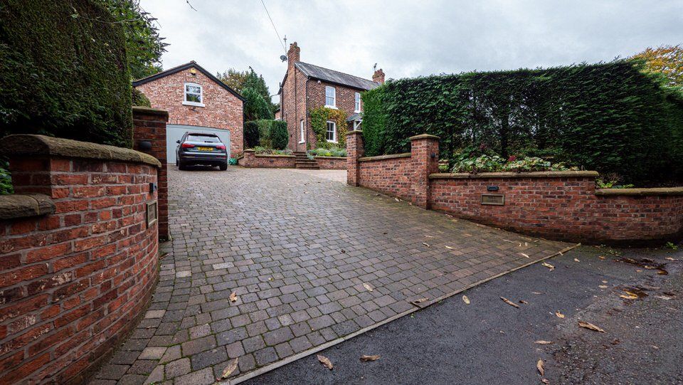 Renovated Cheshire home exterior with remodelled driveway by Rawlinson Construction 