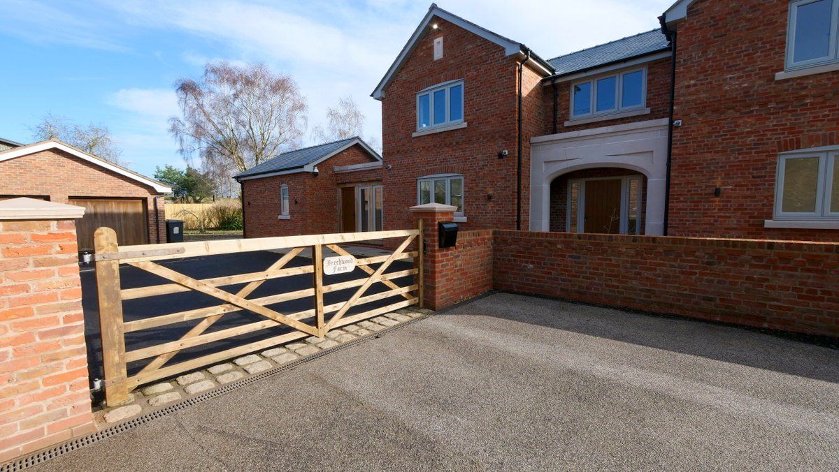 Exterior view of new build traditional farmhouse-style family home in Cheshire 