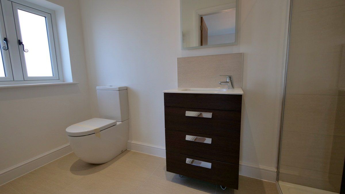High-specification bathroom in a farmhouse style, bespoke new build Cheshire home
