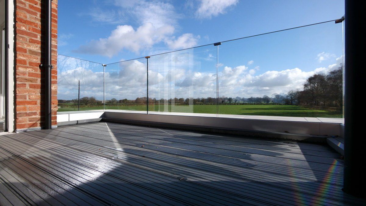 Outdoor terrace area with panoramic Cheshire countryside views in newly built home