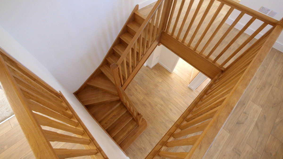 Wooden staircase in Cheshire home showcasing craftsmanship and natural finishes
