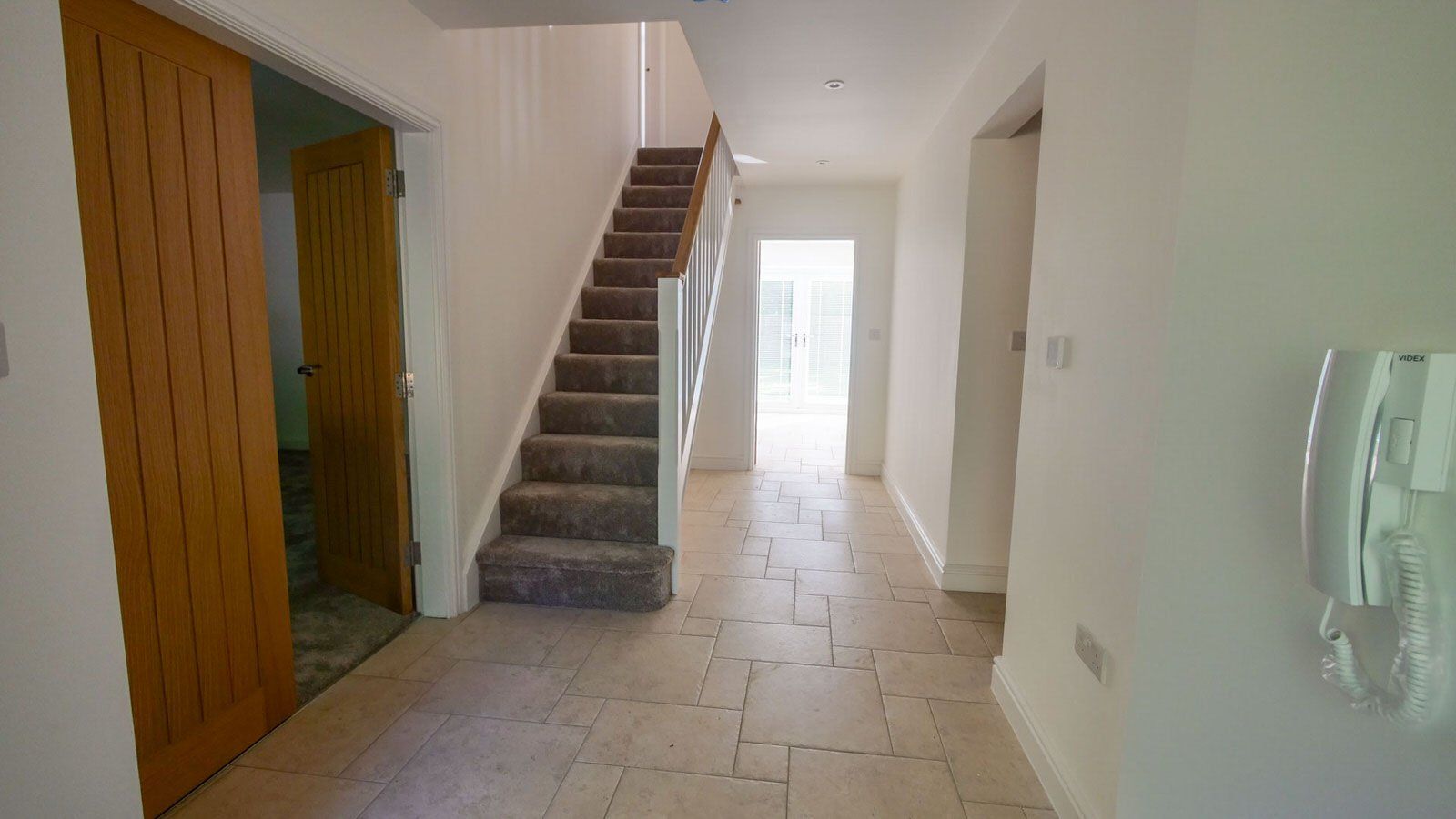 Hallway in a modern, Cheshire new build property by Rawlinson Construction