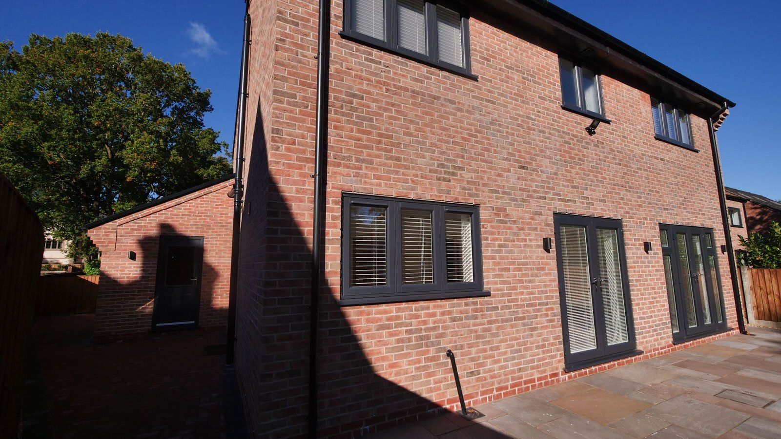 Rear view of a modern new build home by Rawlinson Construction in Cranage, Cheshire