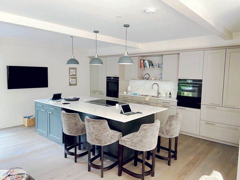 Open-plan modern kitchen in Prestbury home renovated by Rawlinson Construction