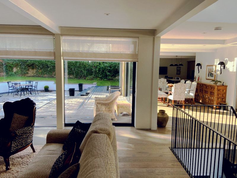 Spacious open-plan living space in Prestbury home renovated by Rawlinson Construction