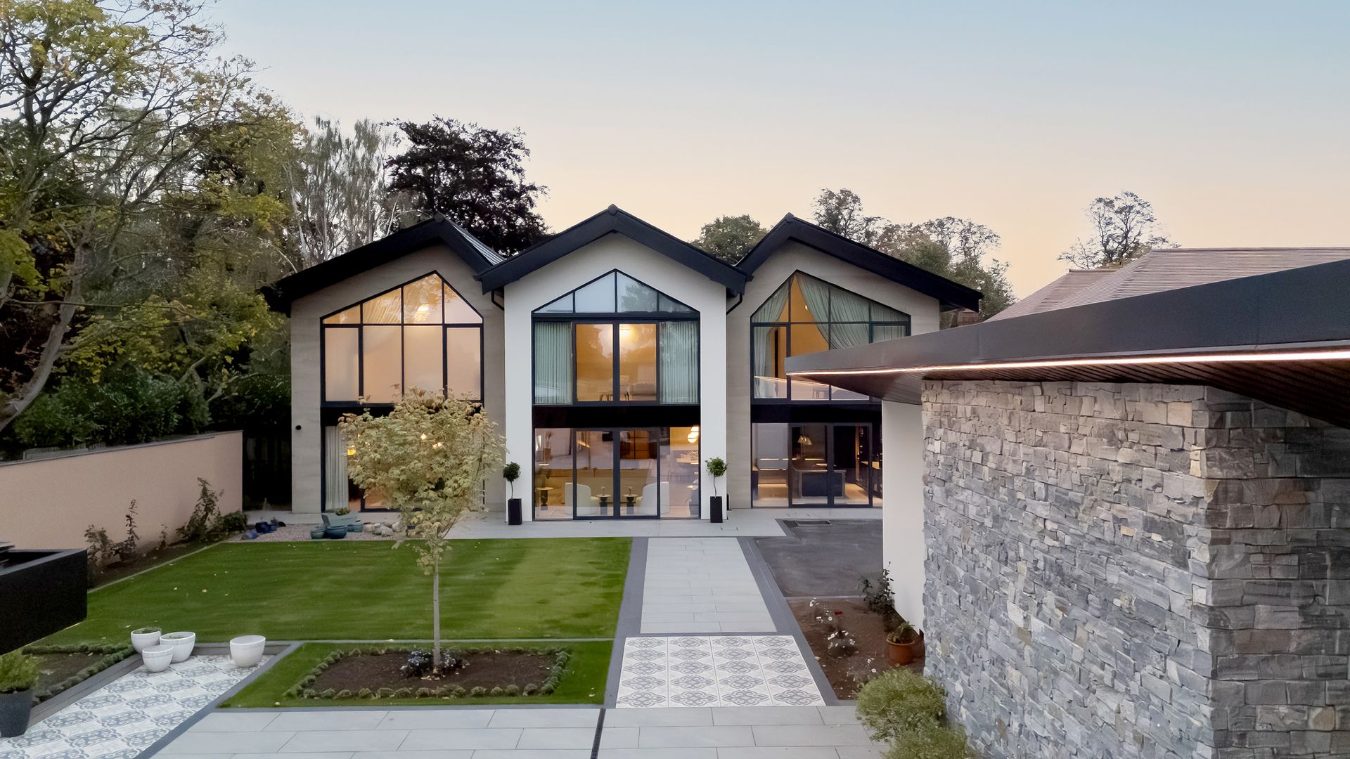 Exterior of a newly constructed luxury home in Cheshire with modern architectural design by Rawlinson Construction