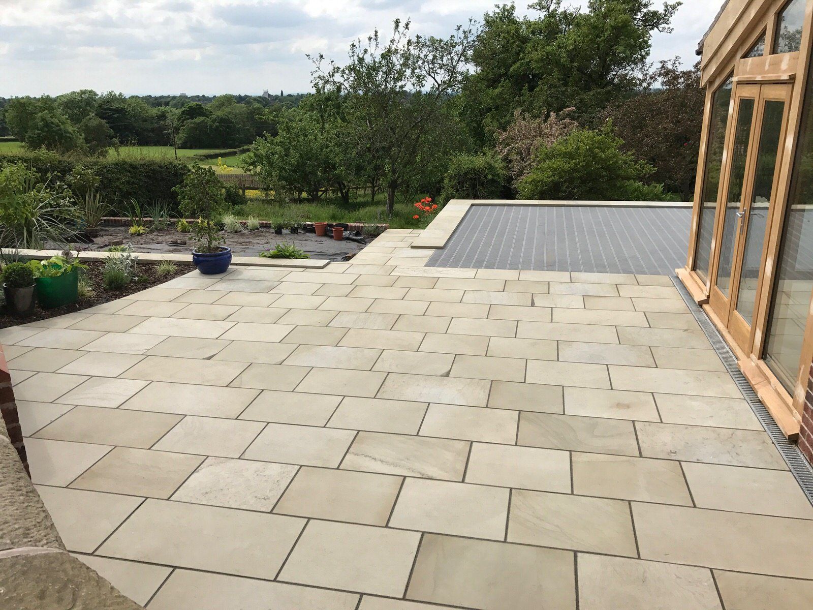 Terrace area outside bespoke home extension at Cheshire property