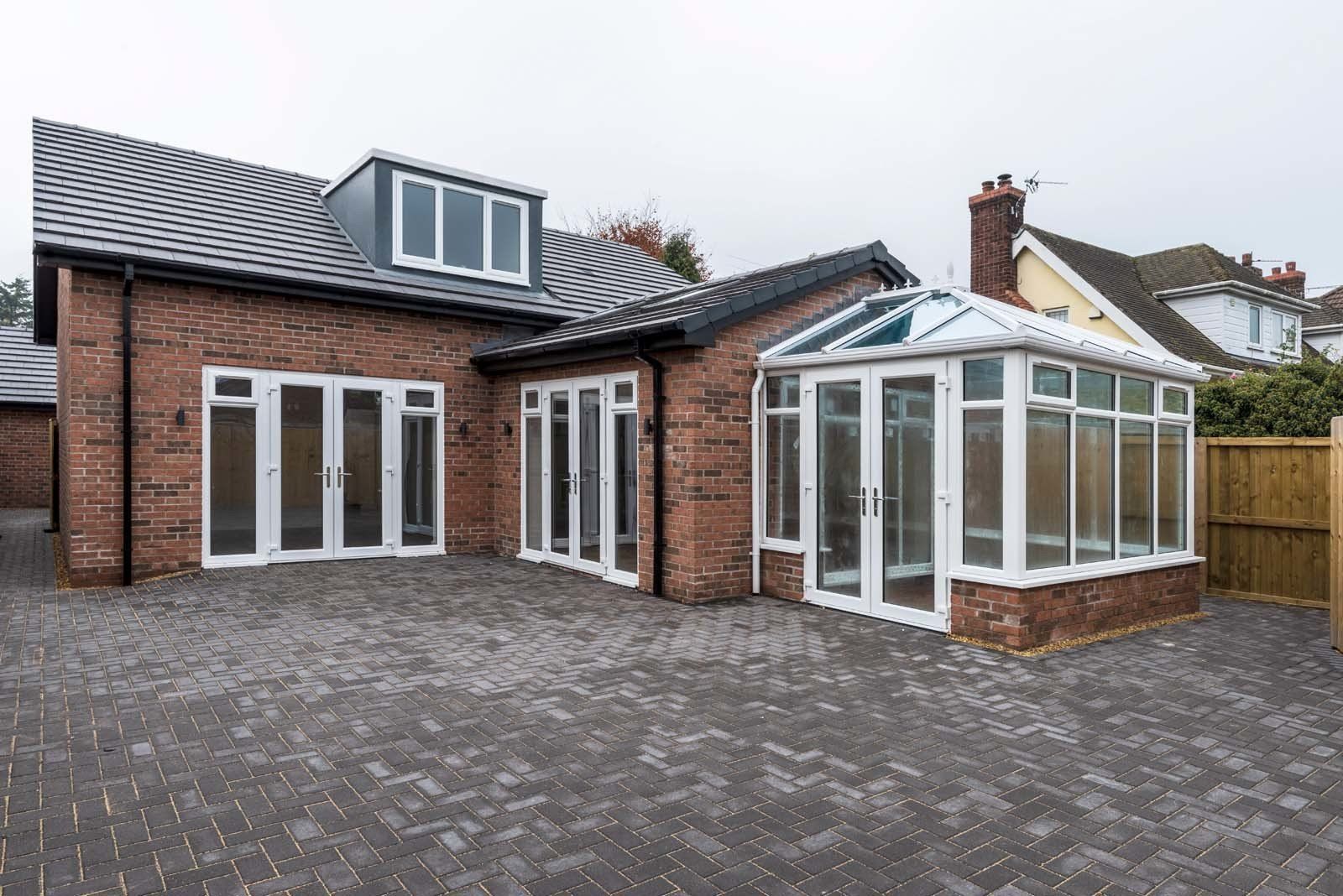 Rear exterior view of newly constructed dormer bungalow on former derelict site by Rawlinson Construction