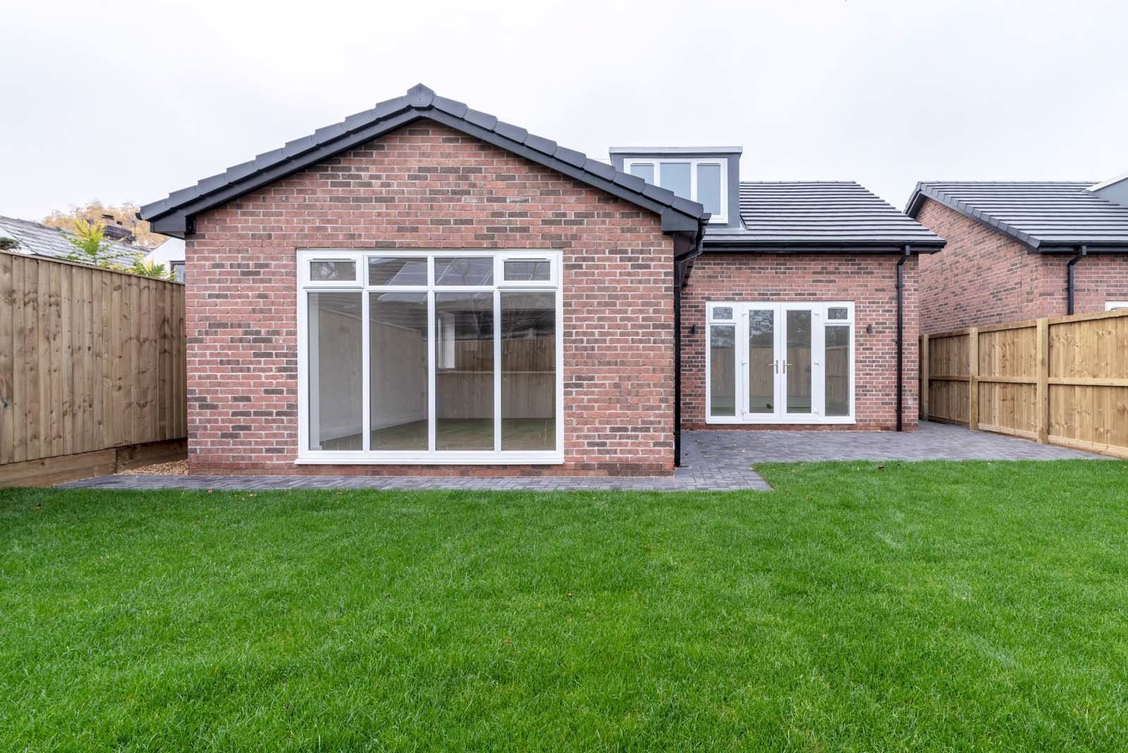 Landscaping complementing high-quality construction of dormer bungalows by Rawlinson Construction