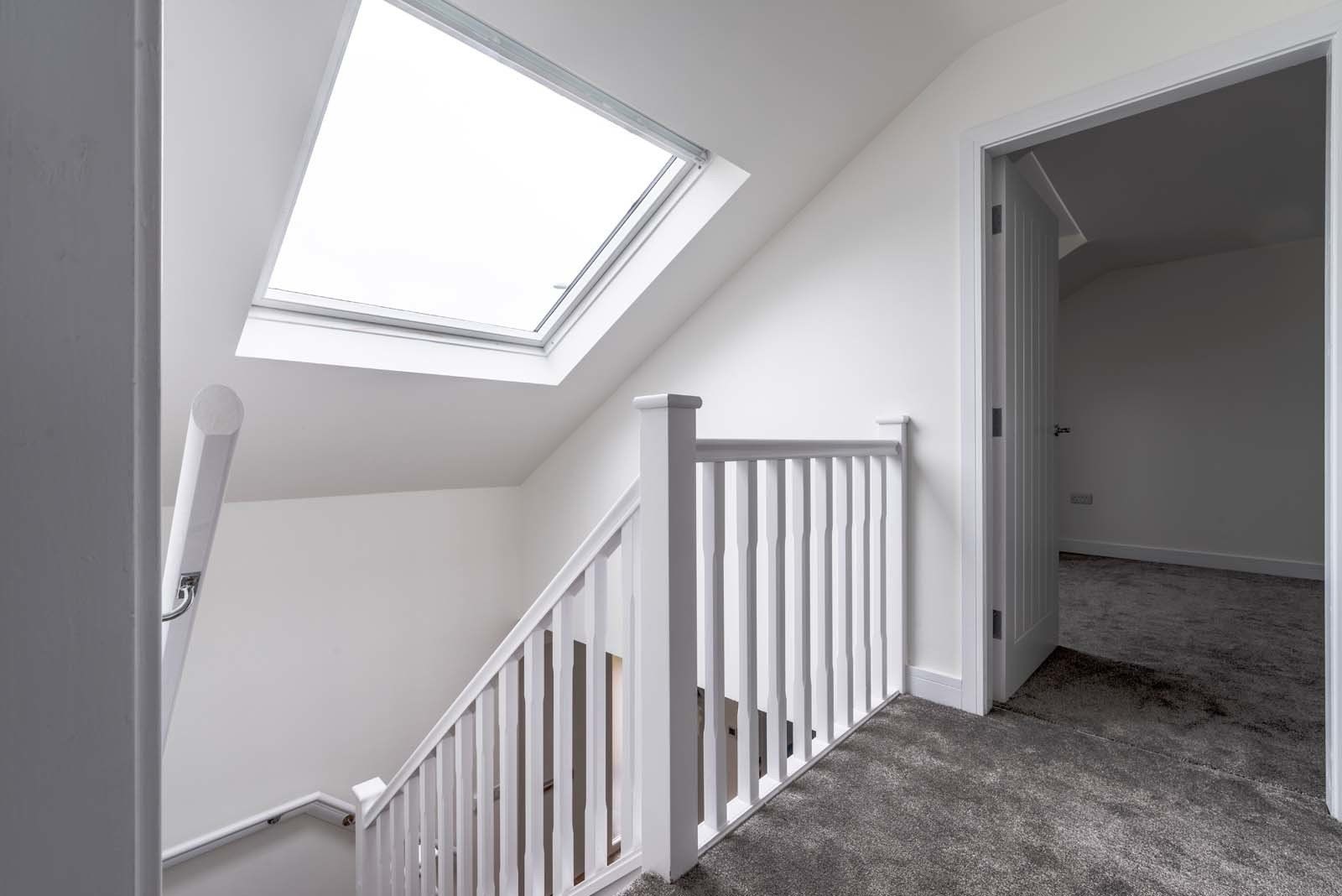 Landing area with natural light in new build home by Rawlinson Construction