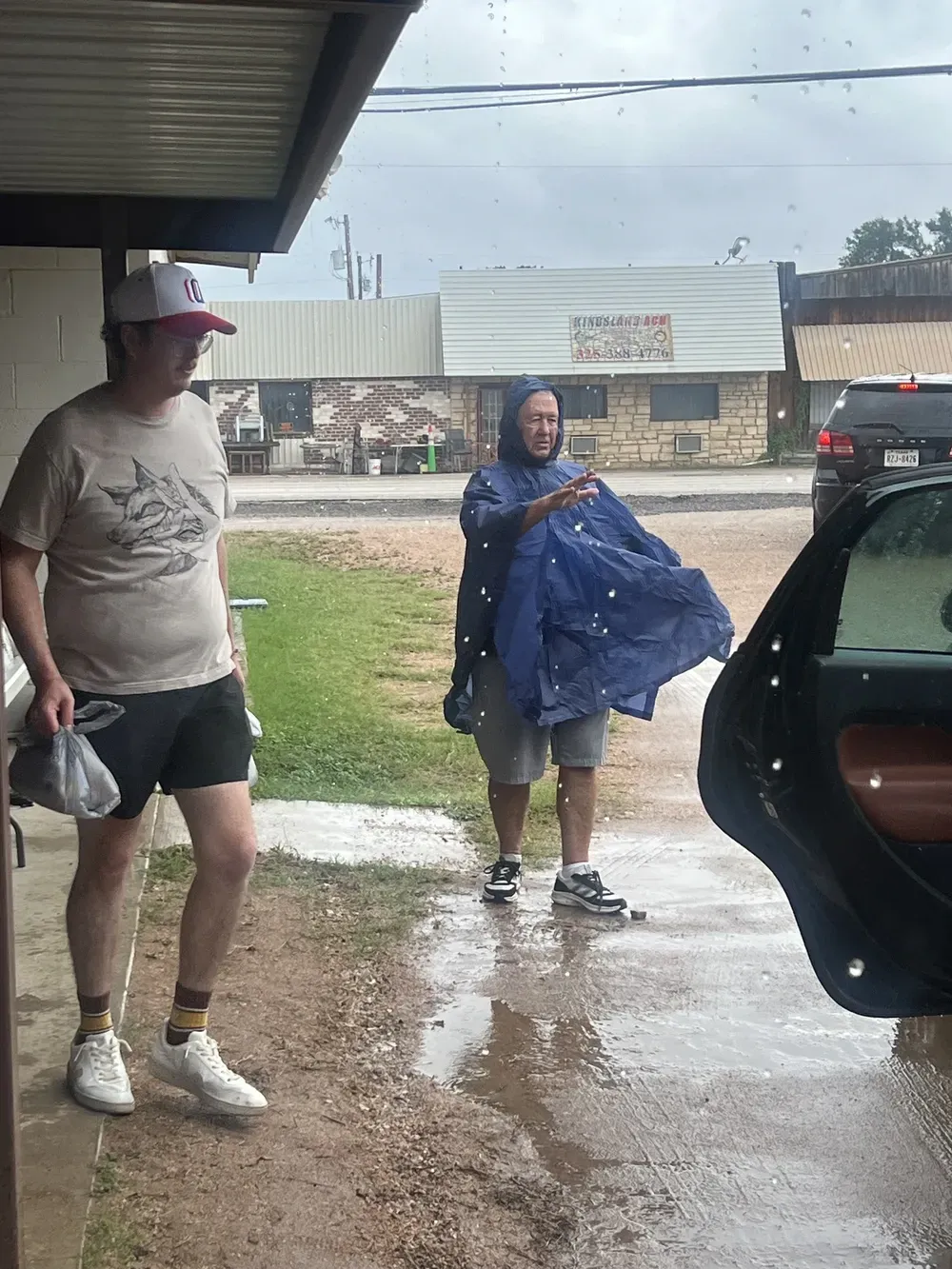 A man and a woman are walking in the rain.