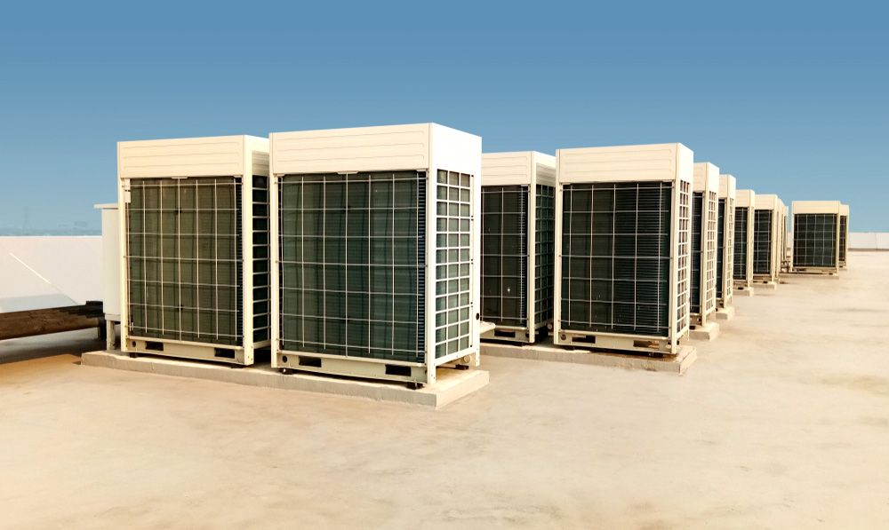A Row of Air Conditioners Sitting on Top of a Roof — Unger Air in South Tamworth, NSW