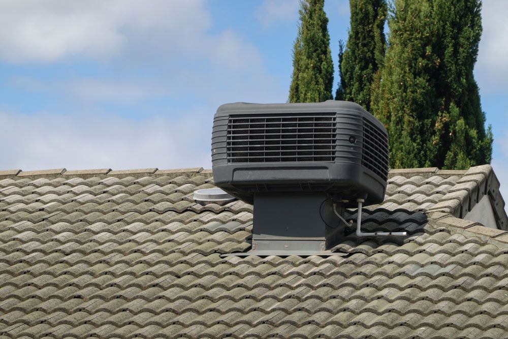 A Black Air Conditioner is Mounted on the Roof of a House — Unger Air in South Tamworth, NSW
