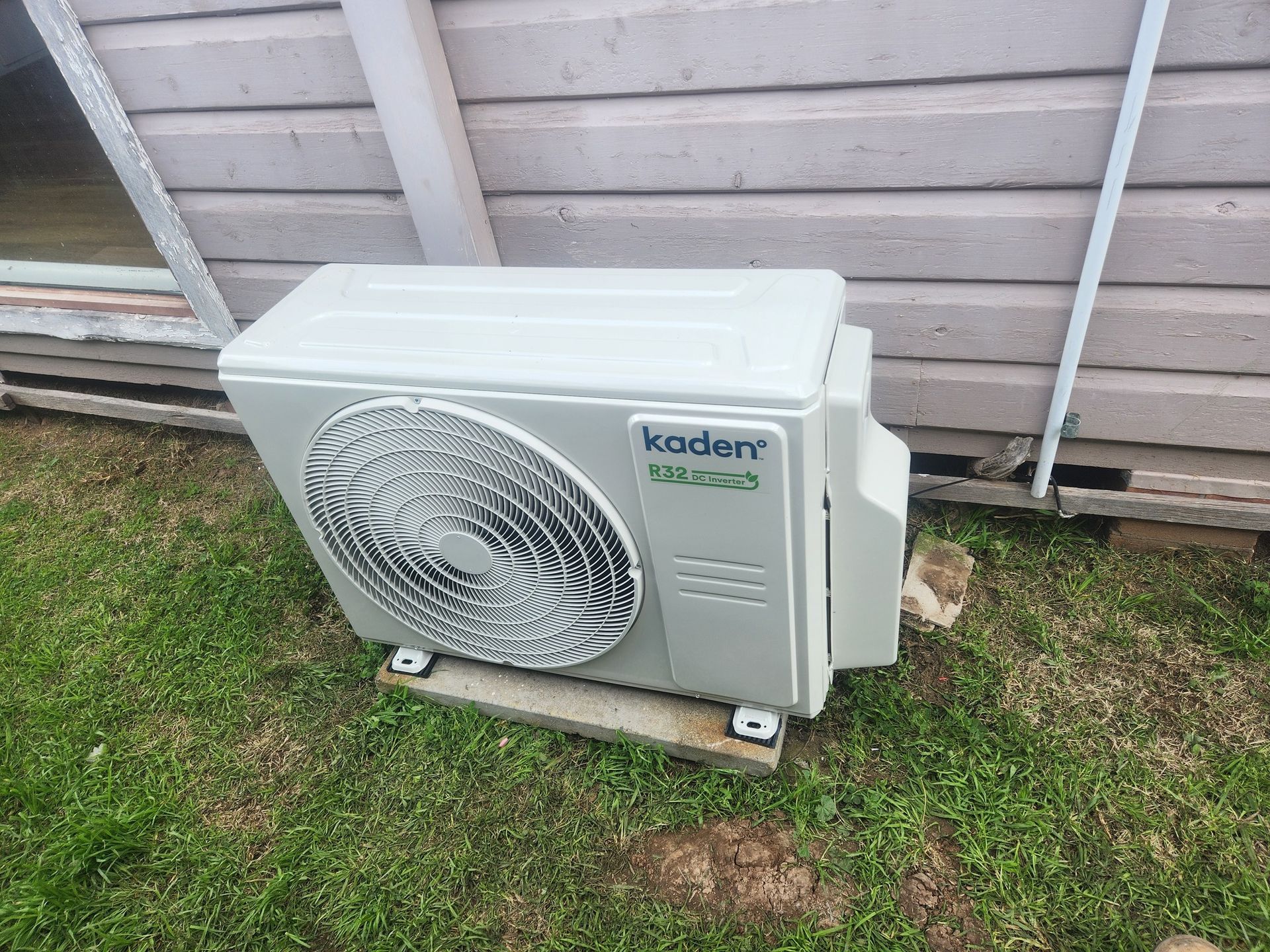 A White Air Conditioner is Mounted on the Side of a Building — Unger Air in South Tamworth, NSW