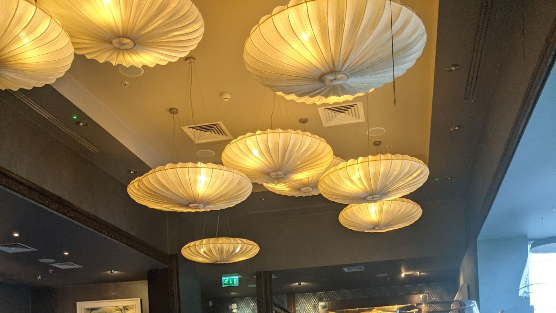 A ceiling with a lot of lights hanging from it