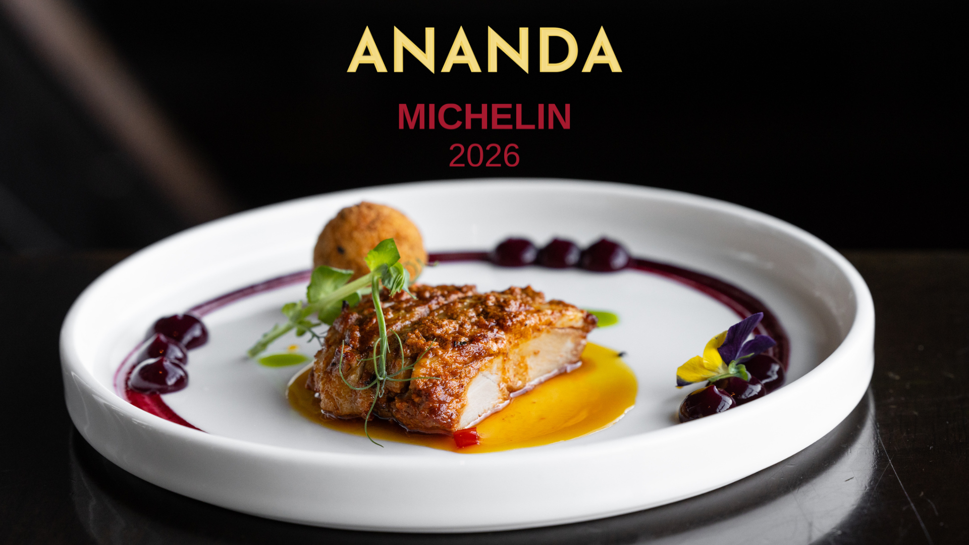 A gourmet dish with a seared protein, a fried sphere, and colorful sauce swirls on a plate under