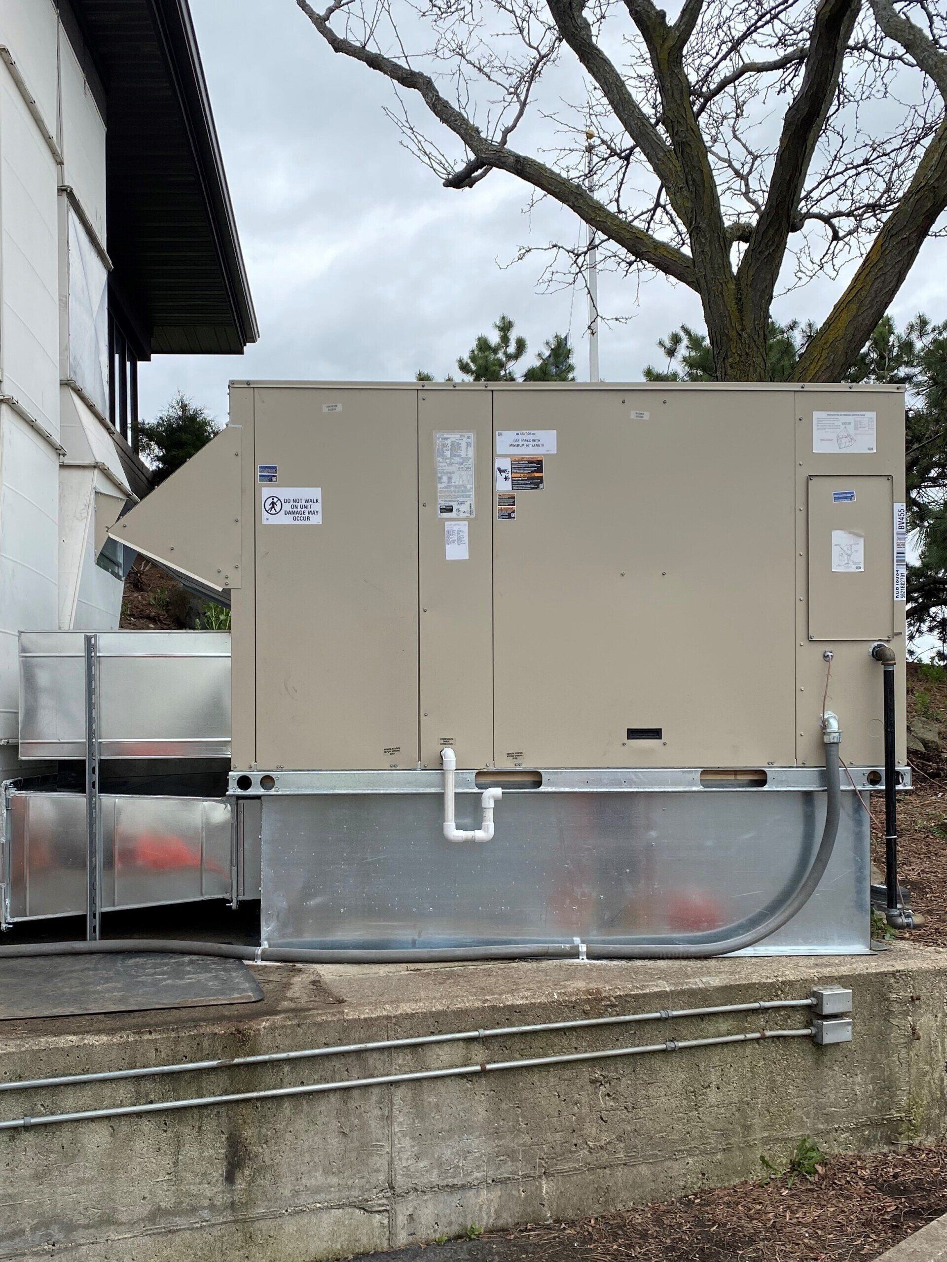HVAC Tech Working — Neenah, WI — Central Temperature Equipment Service Inc. HVAC Tech Working — Neenah, WI — Central Temperature Equipment Service Inc.
