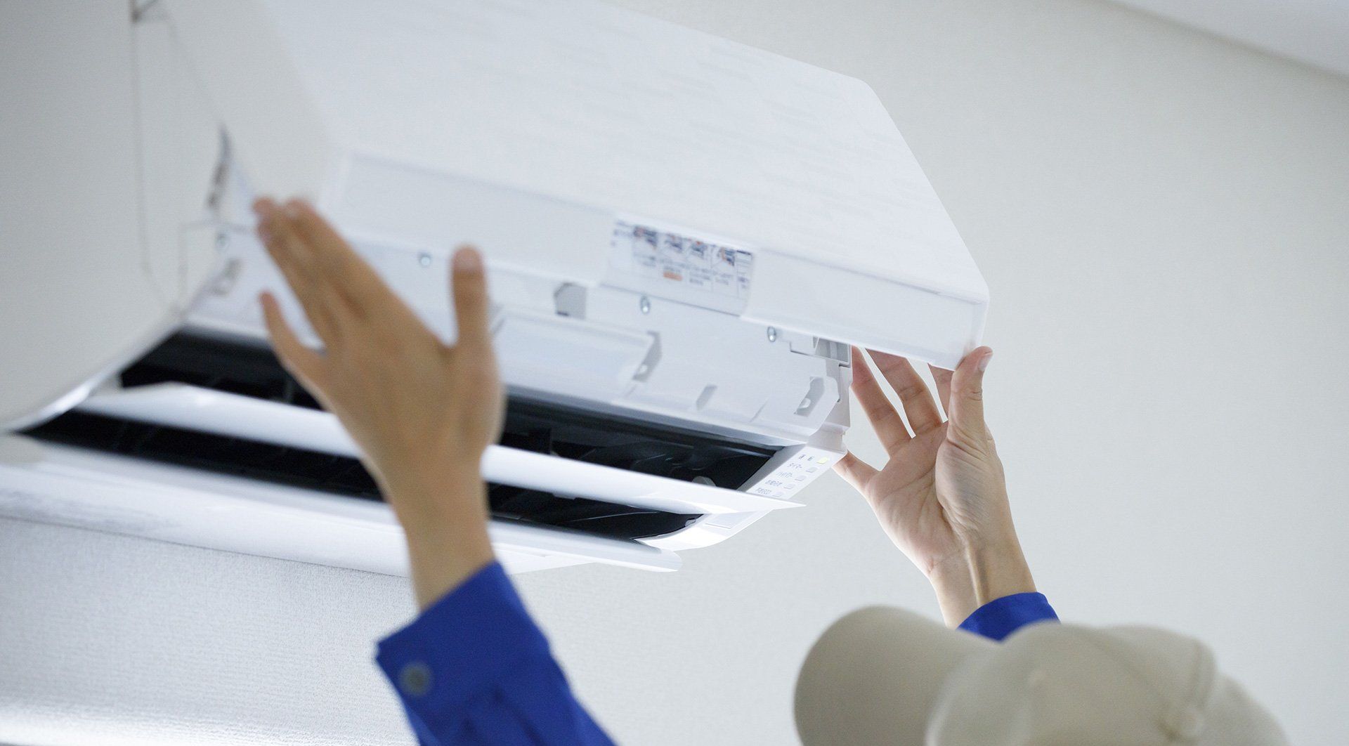 Indoor white air conditioning being installed on the wall