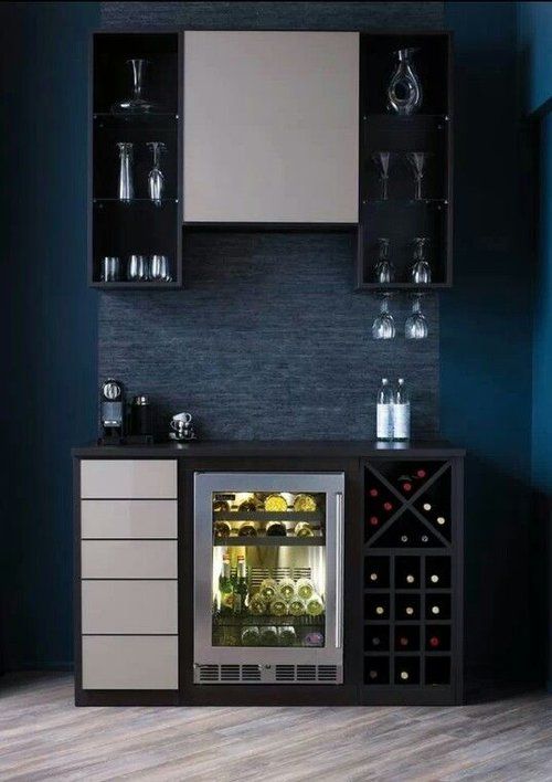 A kitchen with a wine cooler and a wine rack