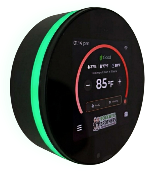 Round black smart thermostat with green light ring displaying 85°F on a digital screen