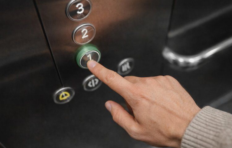 pressing elevator button for compliance test
