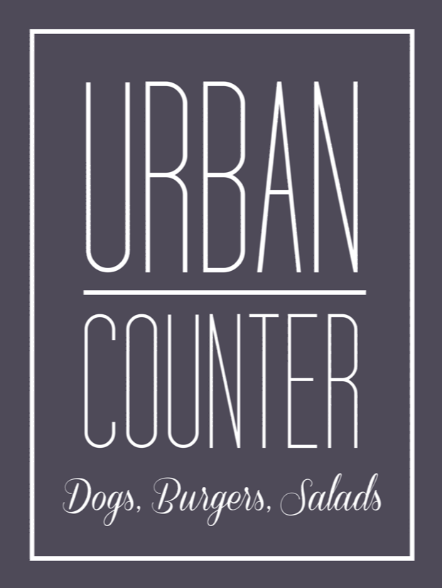 Logo for Urban Counter restaurant; white text on dark gray background.  Features 