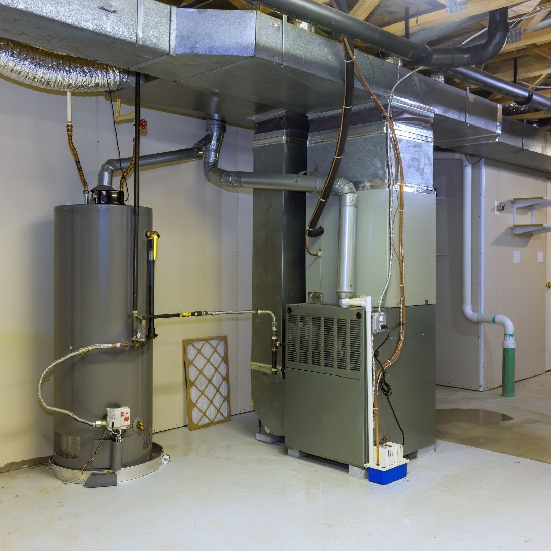 A room with a water heater and an air conditioner