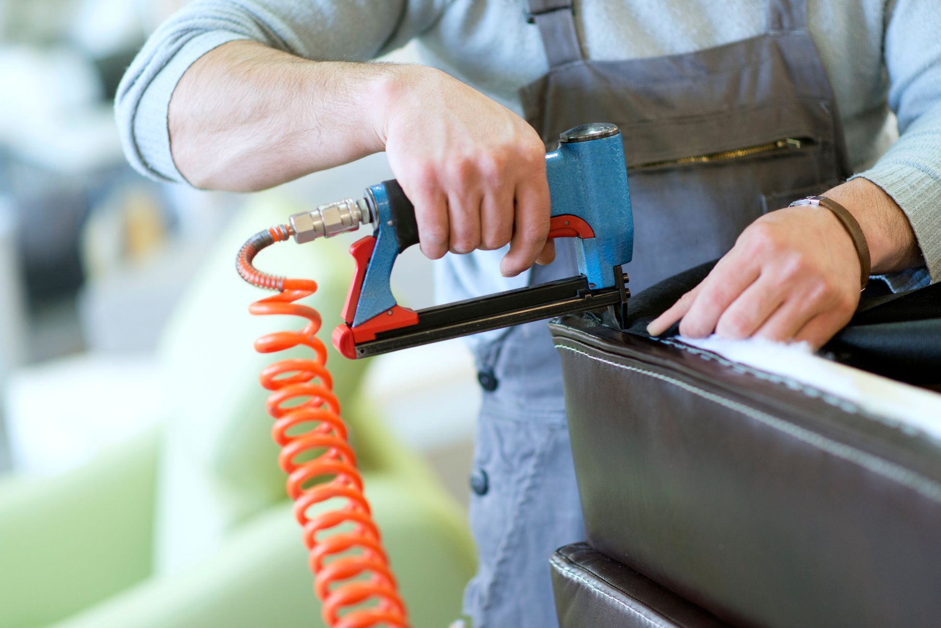 Close-Up of a Man at Work How Upholstering Furniture | Brisbane, Qld | Impact Leather Care