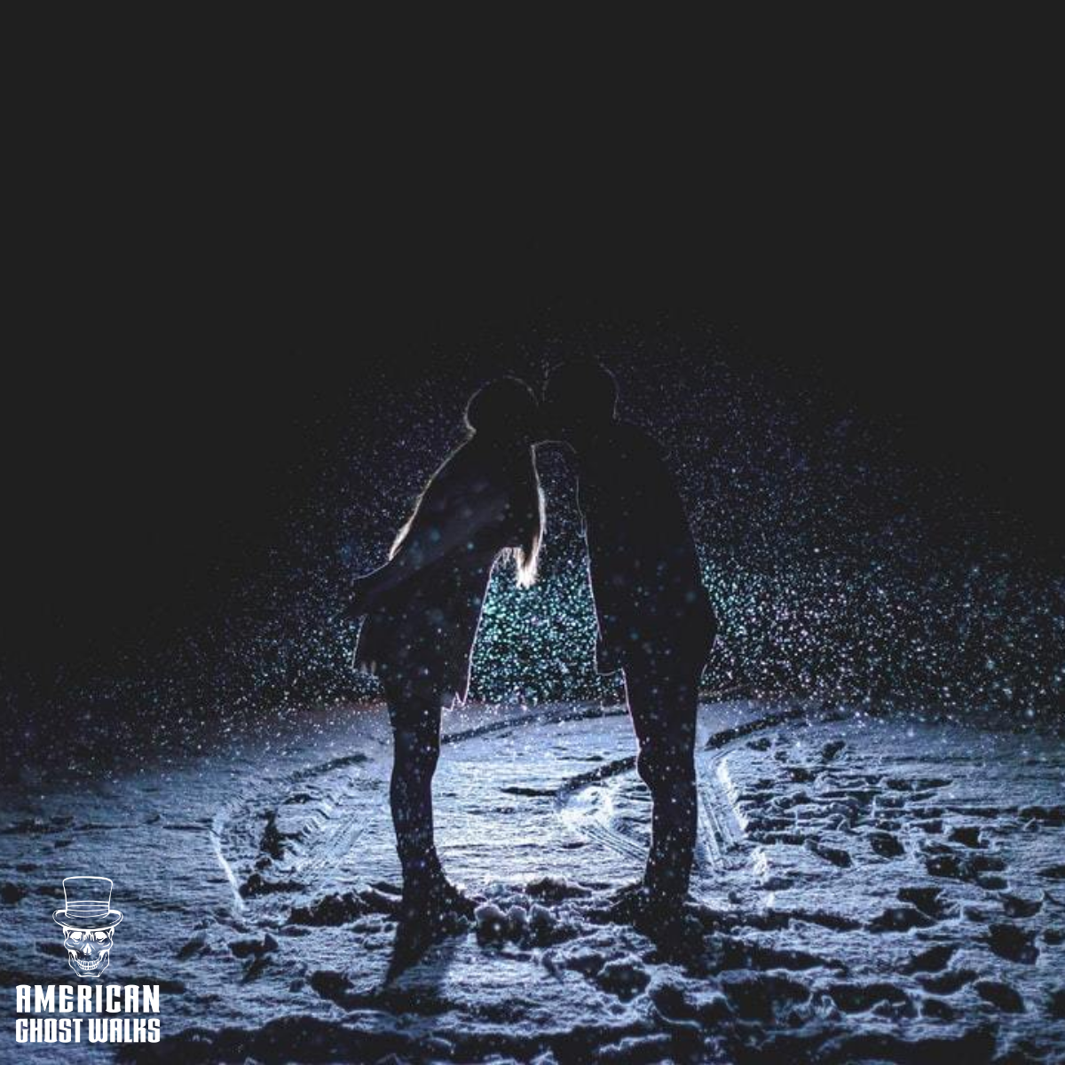 A man and a woman are kissing in the snow.