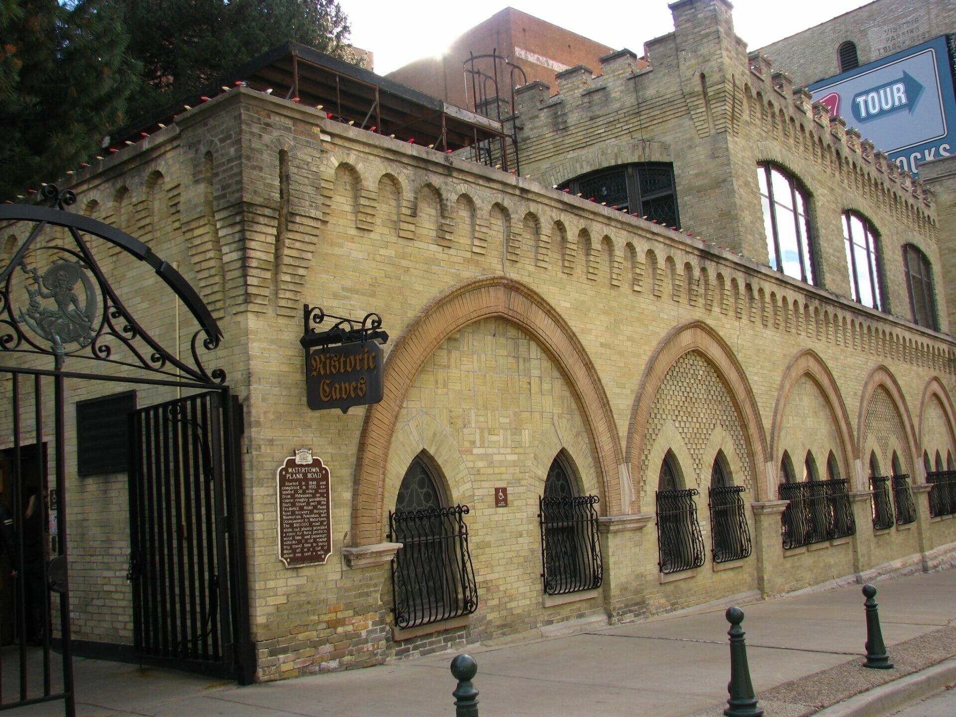 A brick building with arches and a sign that says ' castle ' on it