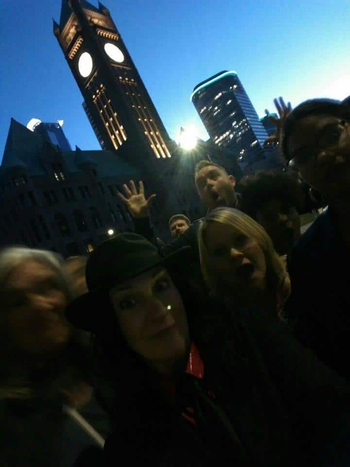 Ghost hunters on a Minneapolis Ghost Walk in front of City Hall