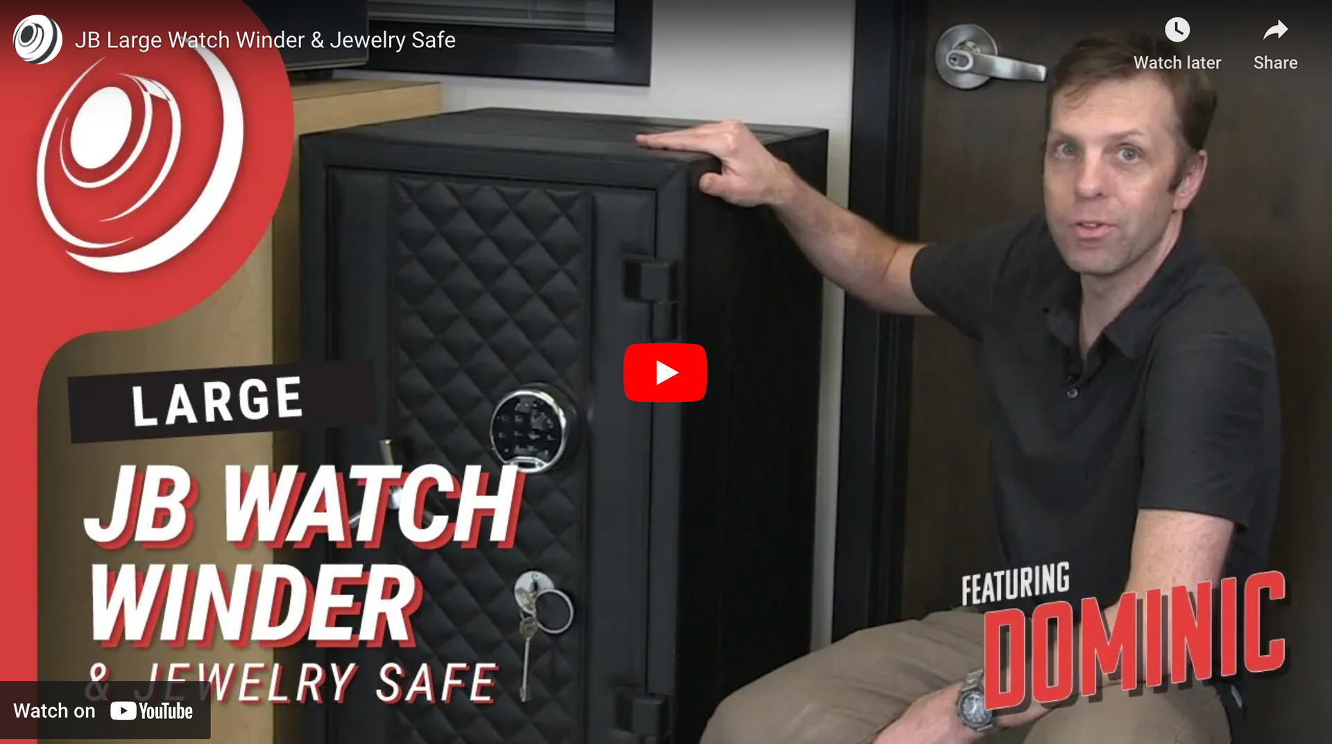 A man is sitting in front of a large jb watch winder safe.