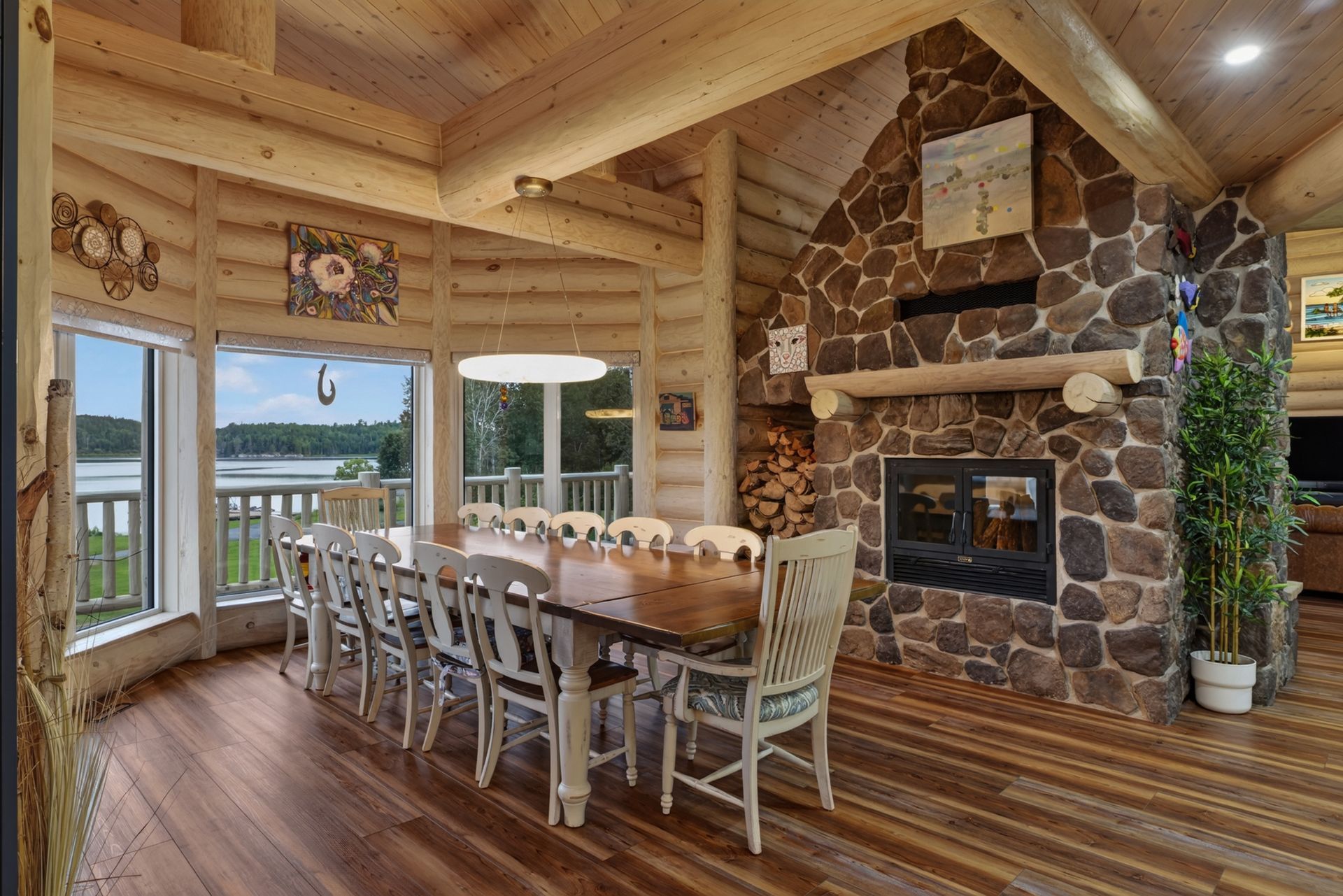 Custom quartzite kitchen with exposed timber and stone fireplace