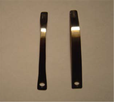 Two silver main springs, one straight and one curved, with a hole in the handle.
