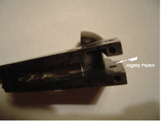 Close-up of a dark metal part, possibly from machinery, with