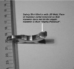 Modified metal part with JB Weld, labeled