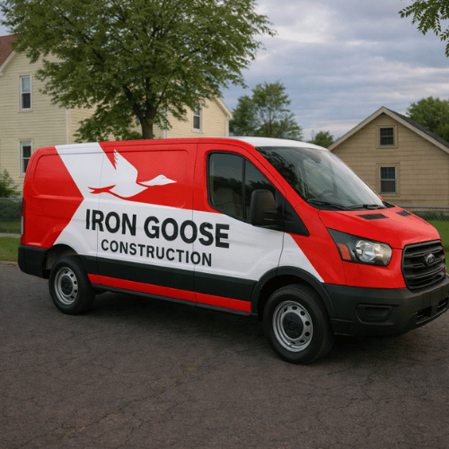 Red and white Iron Goose Construction van parked on a residential street