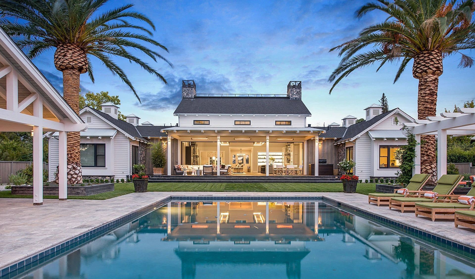 Pool with home behind it