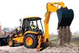 Yellow backhoe loader dumping soil at a construction site