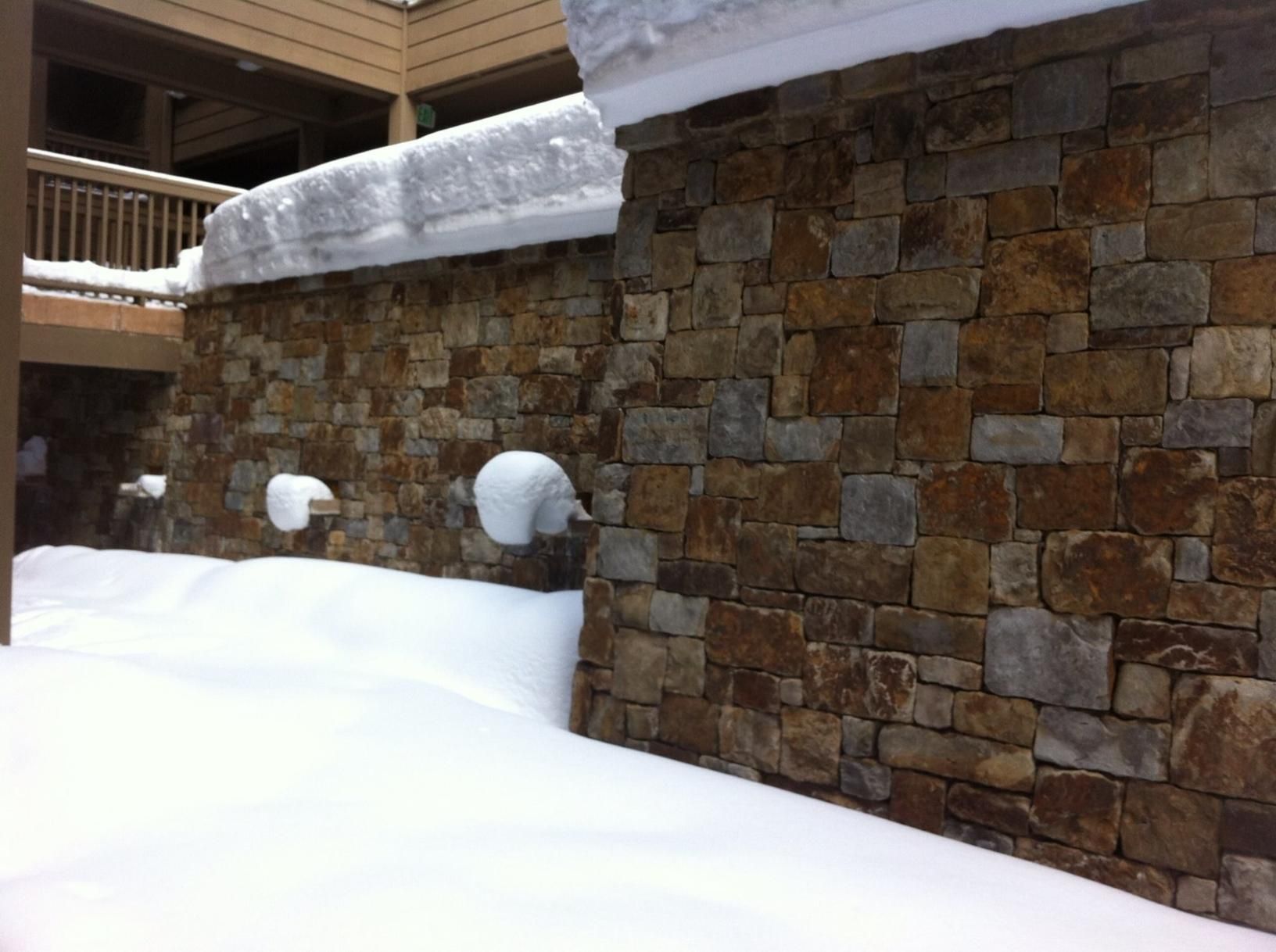 A Stone Wall With Snow On Top Of It — Australian Rock Walls In Moggill, QLD