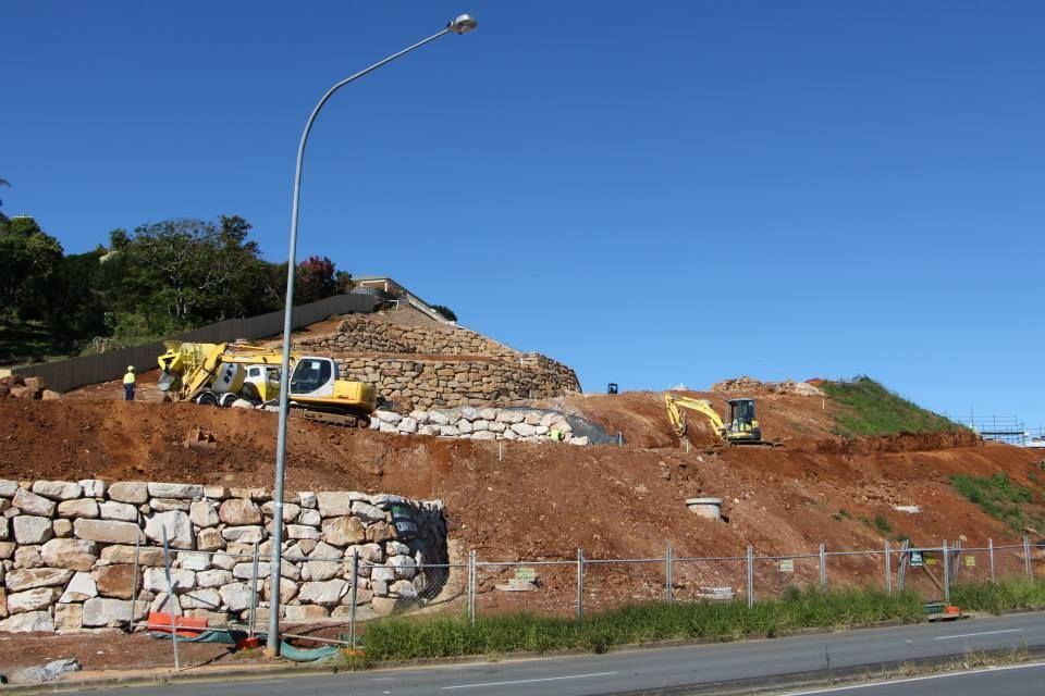 A Construction Site With A Street Light In The Foreground — Australian Rock Walls In Beechmont, QLD