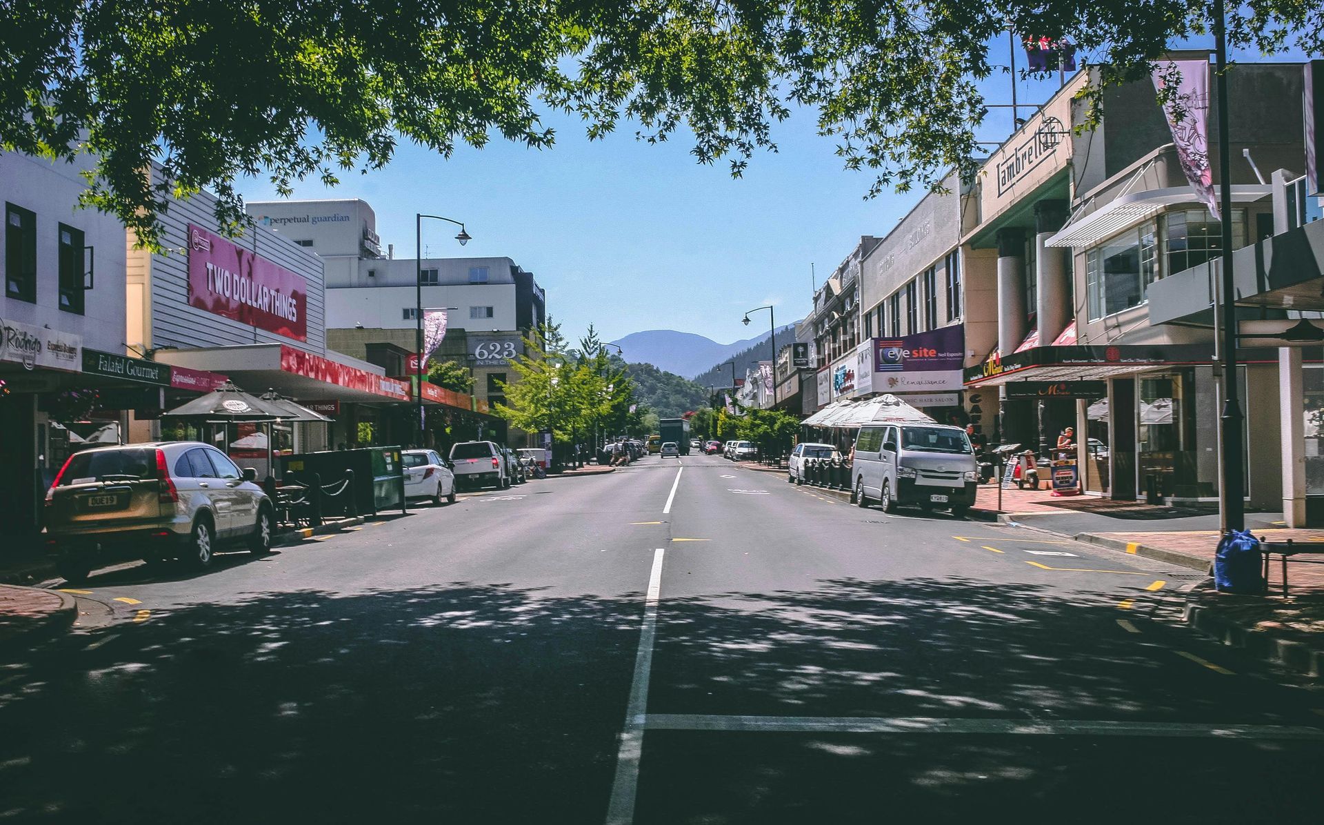 A City Street With A Lot Of Cars Parked On The Side Of It – Australian Rock Walls In Nambour, QLD