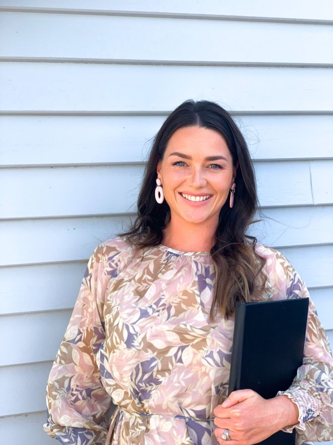 Nelson celebrant Britt holding wedding celebrant folder