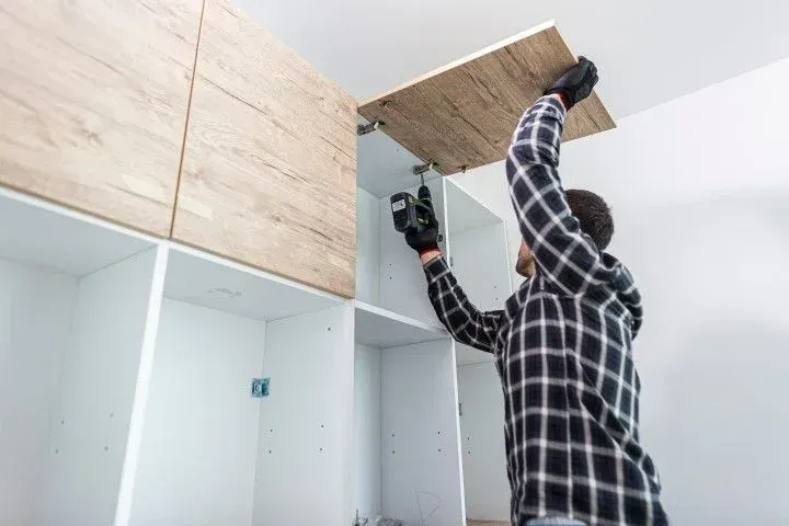 Installing custom wooden kitchen cabinets