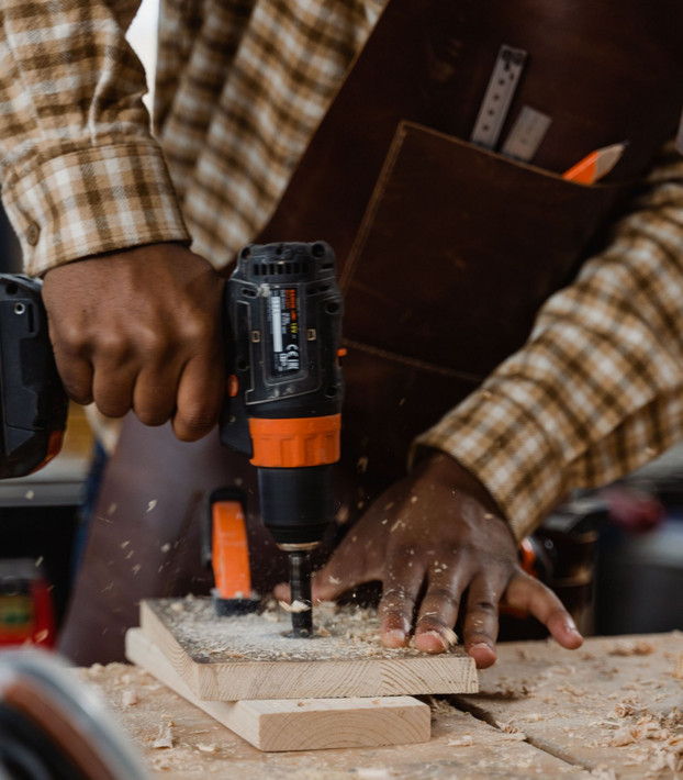 Close up of carpenter holding a power drill