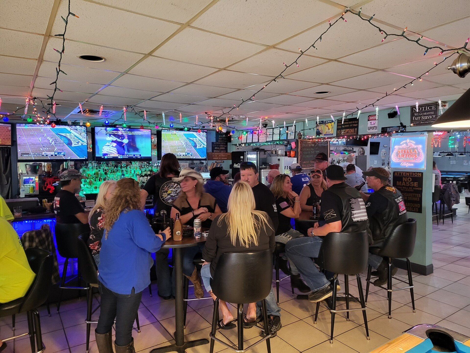 A Group Of People Relaxing At The Bar | Foley, AL | The Office Lounge