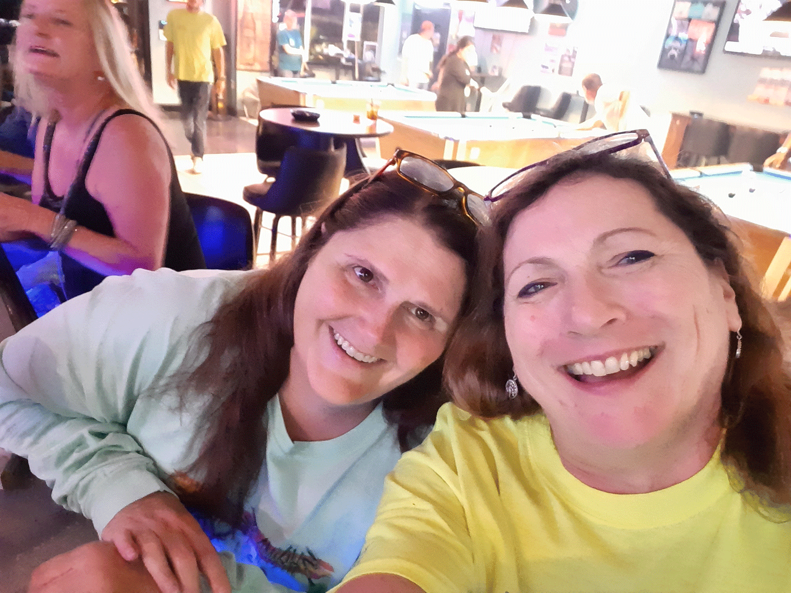 Two Women Smiling While Taking Selfie | Foley, AL | The Office Lounge
