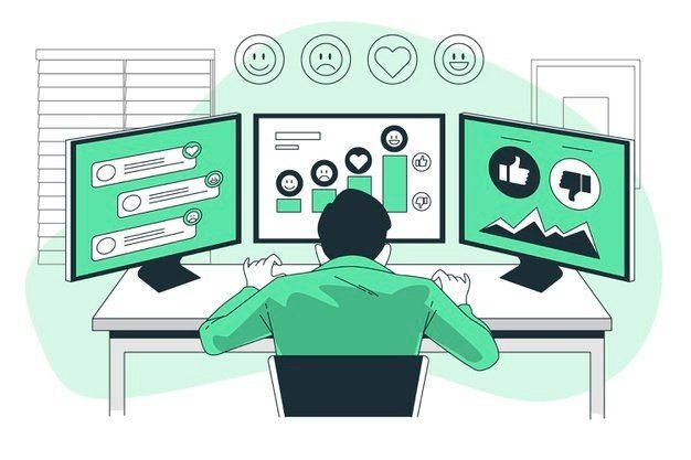 A man is sitting at a desk in front of three computer monitors.