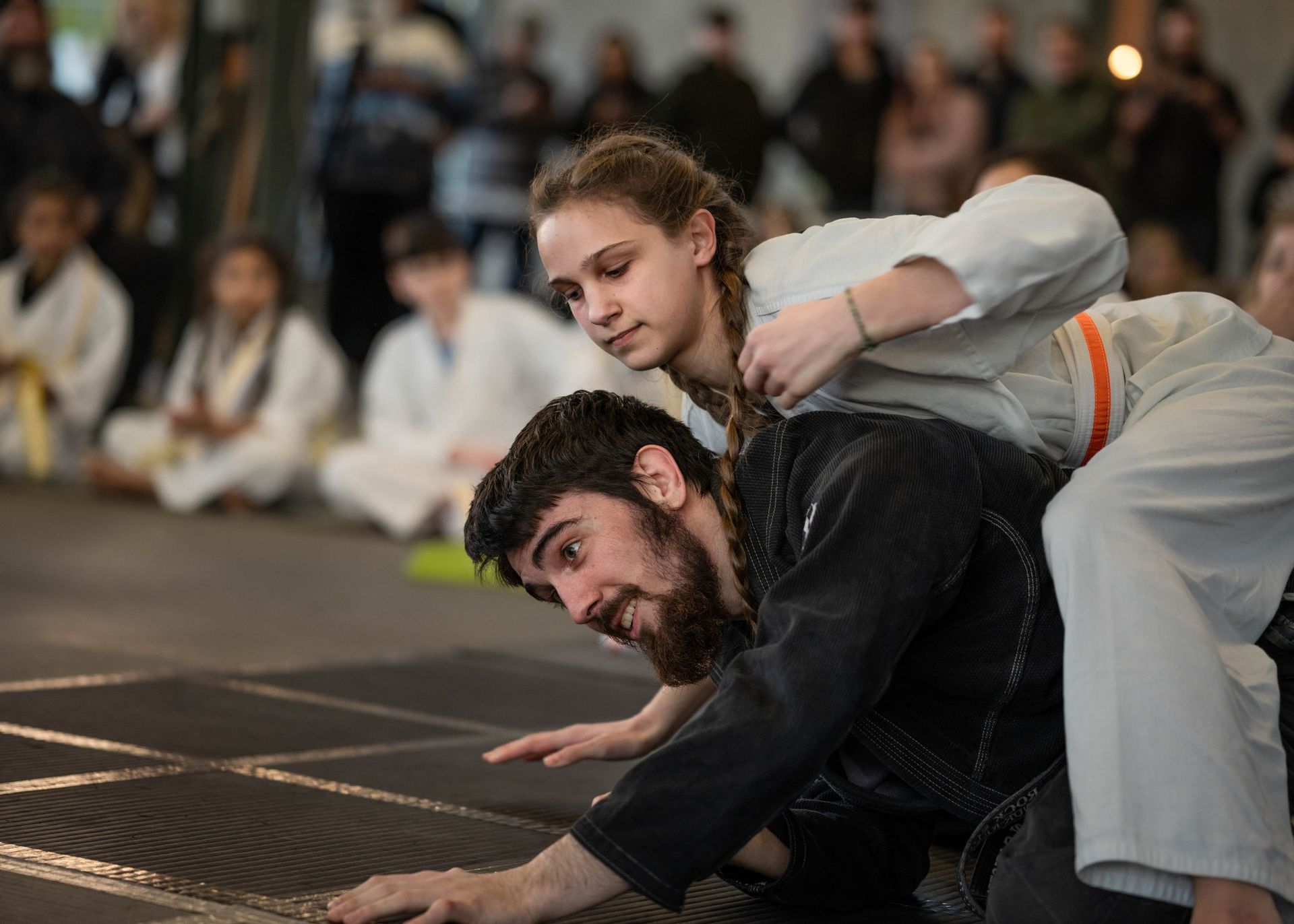 teen martial arts class learning a new sequence together