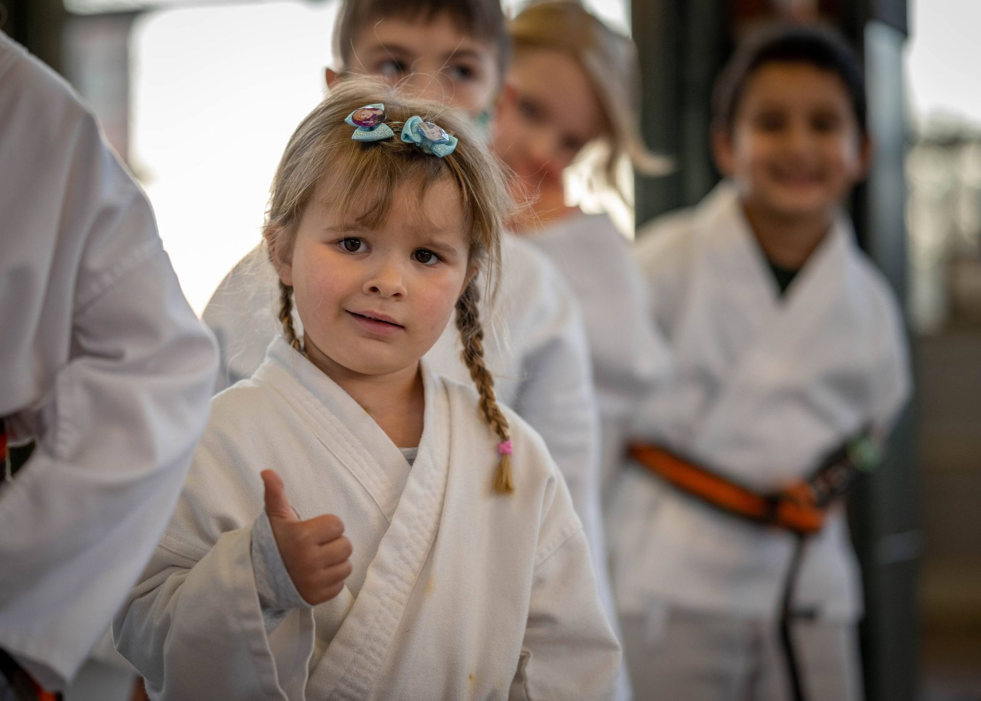 young girl in karate uniform
